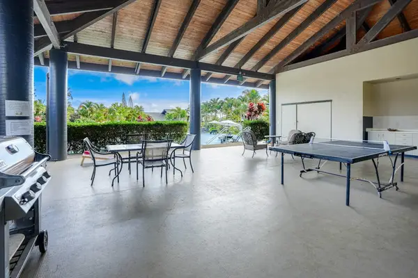 Open air court invites games dining and sweeping tropical garden views