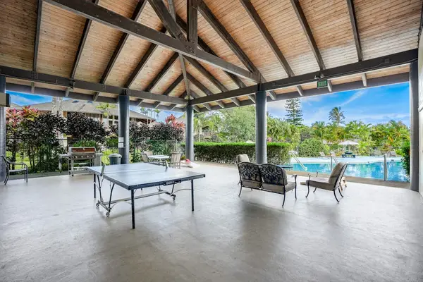 Covered court offers ping pong lounging and poolside island breezes