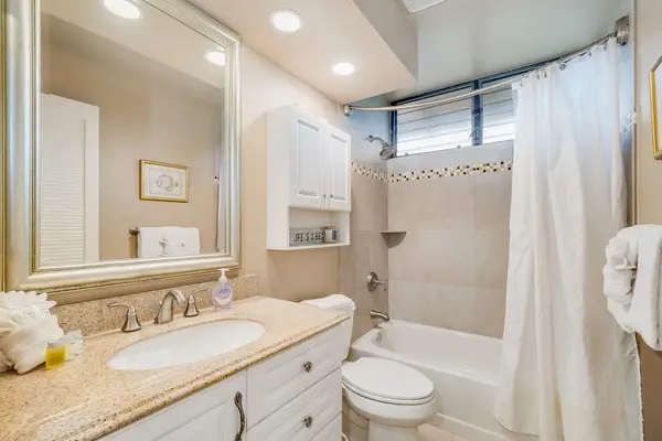 Guest Bathroom with Single Vanity, Overhead Cabinet & Tub/Shower Combo