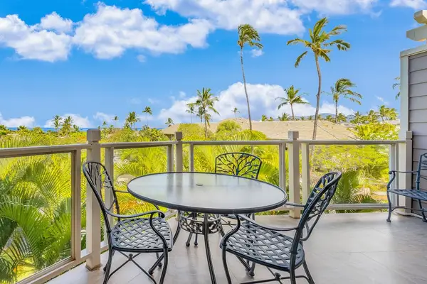 Private Covered Lanai with Outdoor Dining Set overlooking Tropical Palms