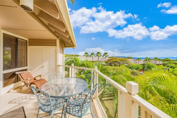 Sunlit Covered Lanai Space Complete with Lounge Chair & Dining Table