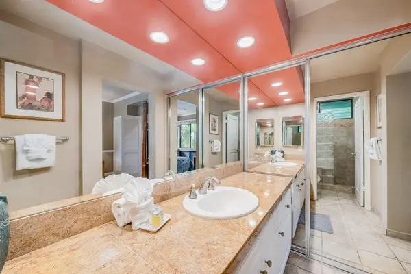 Double Vanity with Marble-Style Countertops, Recessed Lighting & Large Mirror