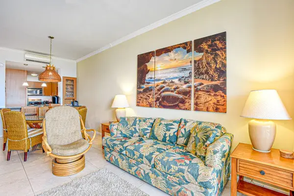 Unwind into vacation mode on a sleeper sofa in the living area. In the evening, kick back and stream a movie on the 65” smart TV. Slide open the glass door to the lanai for the soothing sound of the surf.