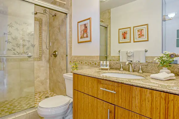 Fabulously updated master bathroom with large walk-in shower.