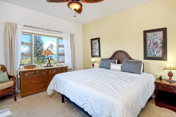 Master bedroom with king bed, large picture windows and an ensuite bathroom.