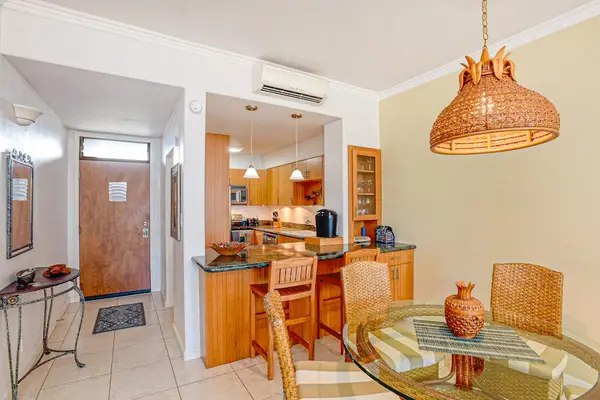 Gather for meals around the dining table, which seats four comfortably. Enjoy a hearty breakfast at the kitchen bar with seating for two.