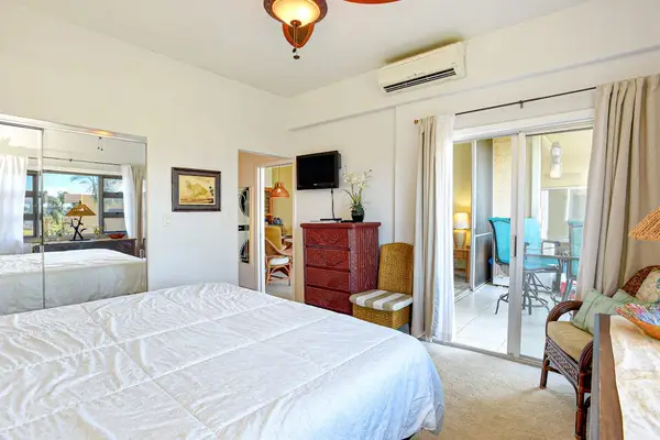 Master bedroom with king bed, large picture windows, flat screen tv  and an ensuite bathroom.