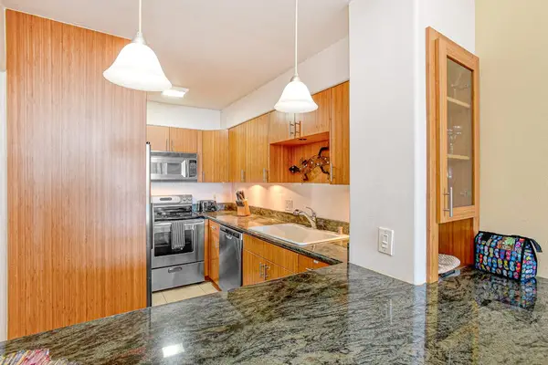 Prepare fresh ingredients in the sleek kitchen, complete with granite countertops and a full suite of stainless steel appliances.