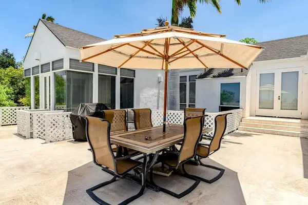 Balcony dining area with BBQ creates the perfect setting for shared memorable meals