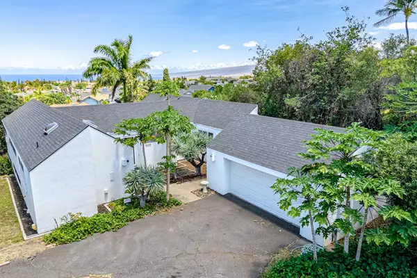 Soaring above, admire the beautiful home surrounded by captivating landscapes and scenic views