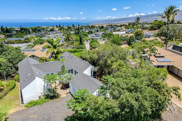 Bird's-eye view reveals charming home, scenic balcony, and breathtaking neighborhood surroundings together