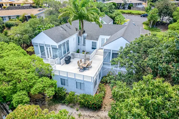 Stunning aerial perspective highlights inviting balcony and picturesque surroundings around the beautiful home