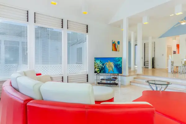 Curved half-round sofa creates a cozy centerpiece for relaxing after exciting adventures