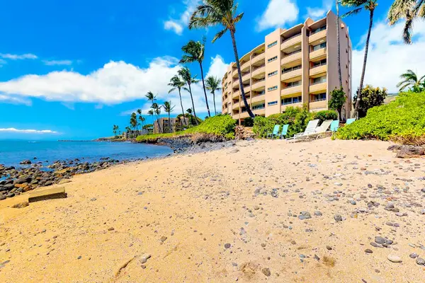 Relax on pristine white sandy beaches beneath swaying palm trees and gentle ocean breezes.