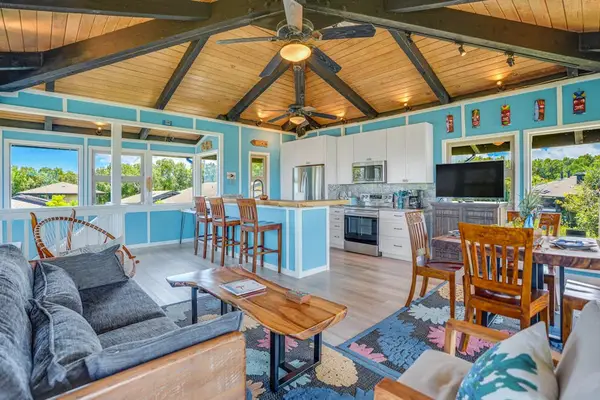 Living room with panoramic views comfortable seating and a flat screen tv.