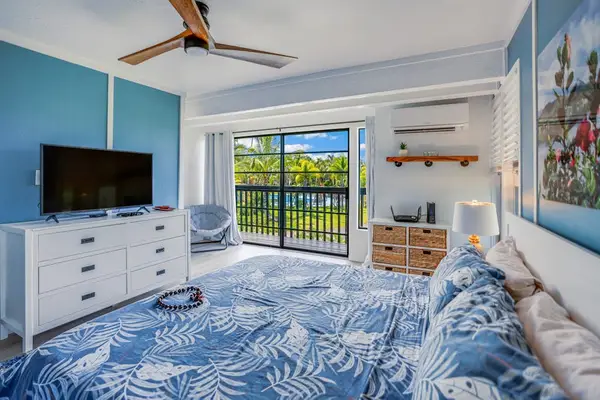 Master bedroom with king bed, flat screen tv and private lanai access.