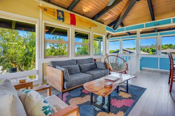 Living room with panoramic views comfortable seating and a flat screen tv.