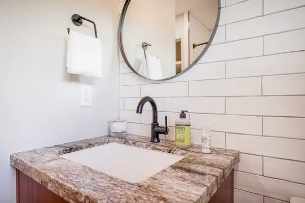 Modern Vanity with Stone Countertop & Matte Black Fixtures