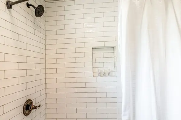 The Oasis Bath Shower with Subway Tile & Built-In Niche