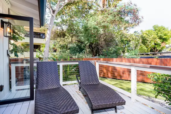 Private Outdoor Deck with Sun Loungers & Lush Garden Views