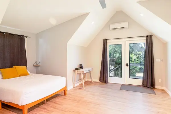 Queen Guest Suite with Private Balcony Access & Vaulted Ceilings