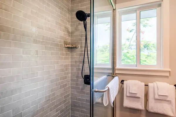 The Guest Retreat Bath Walk-In Tile Shower with Window & Matte Black Hardware