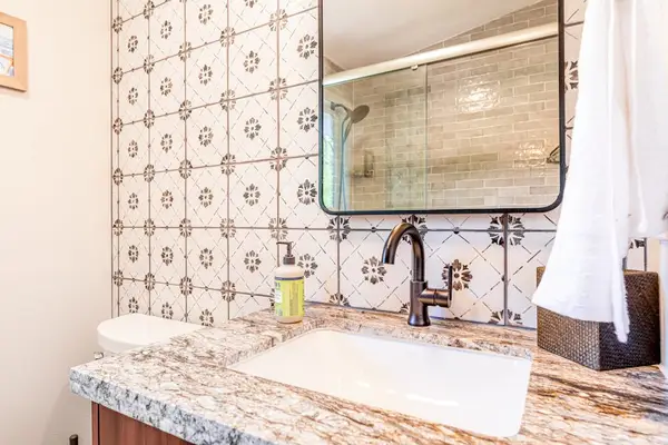 The Guest Retreat Bath Vanity with Patterned Accent Tile & Stone Top