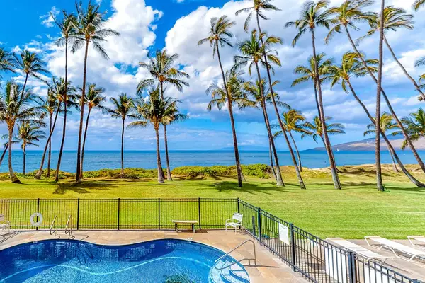 Poolside Bliss Beneath Swaying Palms