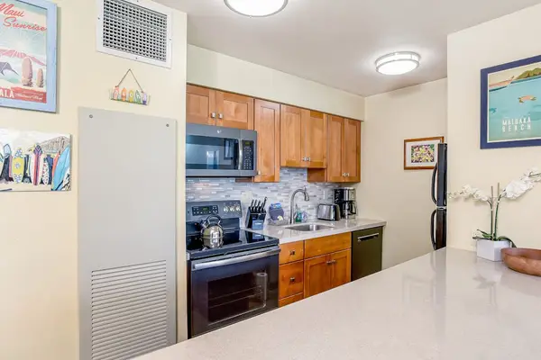 Newly remodeled kitchen with stainless steel appliances.