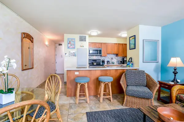 Cozy living areaBarstools at kitchen counter for extra seating.