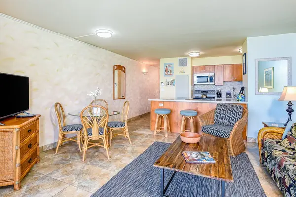 Cozy open-concept living space with a dining area and a full kitchen