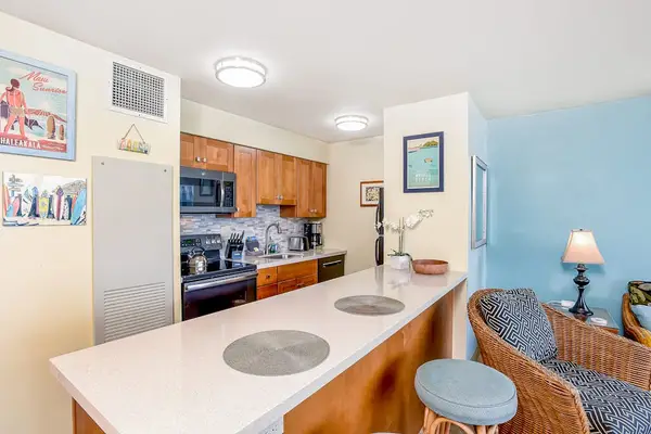 Barstools at the kitchen counter for extra seating.