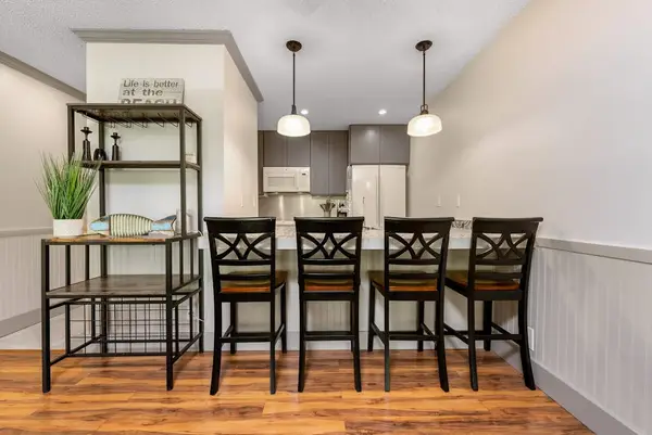 Dining room features seats stylish lighting and warm floors