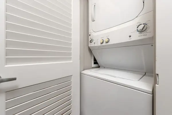 Washer and dryer are conveniently tucked inside a dedicated closet