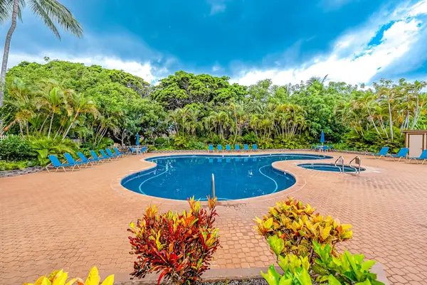 Sparkling resort pool creates a relaxing tropical setting for guests