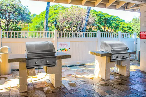Take advantage of the community BBQ area with grills, picnic tables, chairs, and an outdoor refrigerator—perfect for enjoying meals in the Hawaiian sunshine.