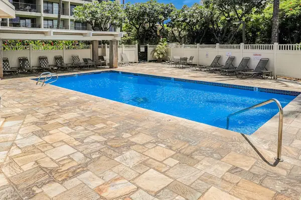 Relax by the resort pool with comfortable lounge seating and a spacious pool deck