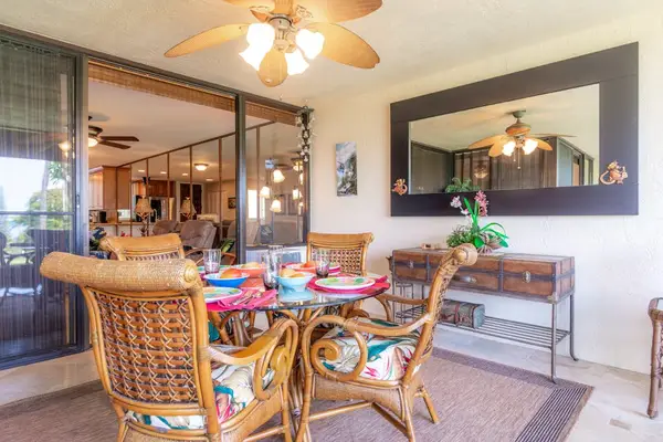 Indoor Dining Table with Island-Style Wicker Seating