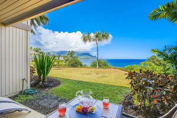 Open terrace blends practical furnishings with lush tropical landscaping nearby