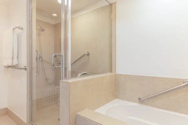 Glass Walk-In Shower and Soaking Tub in Primary En-Suite