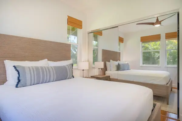 Secondary Bedroom with Queen Bed and Mirrored Closet Doors