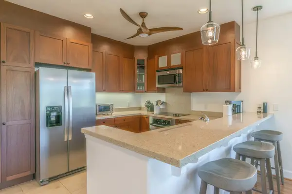 Fully Equipped Gourmet Kitchen with Breakfast Bar Seating