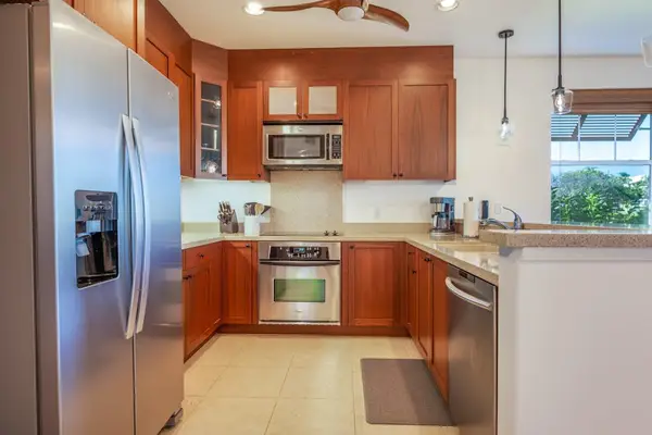Modern Kitchen with Stainless Steel Appliances and Warm Wood Cabinets