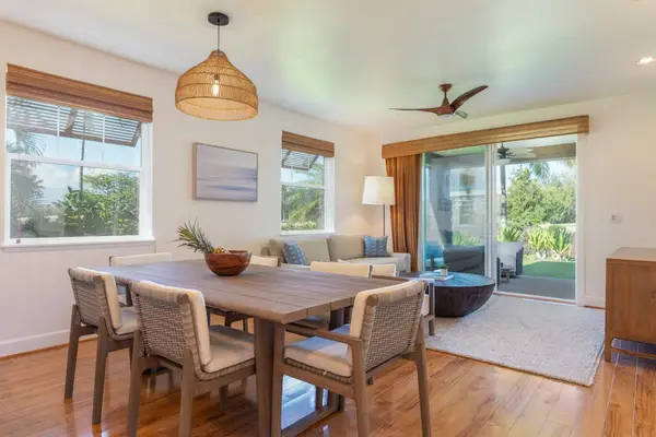 Open-Concept Dining and Living Area with Hardwood Flooring