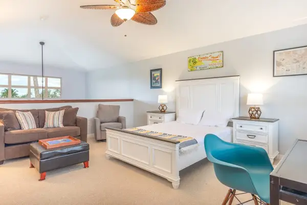 Extra guests no problem - queen beed located in the loft open to the living room downstairs.   Lots of space to relax on the sofa or a desk for any other items that need to be handled.