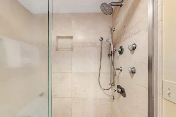 Refresh comfortably in this spacious walk-in shower after beach adventures
