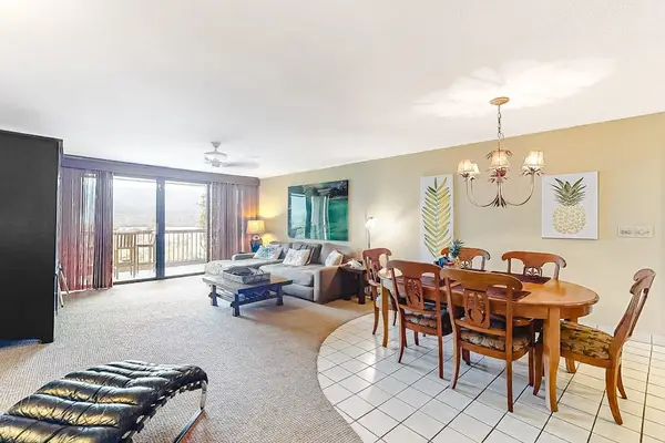 Open living and dining space creates an inviting vacation atmosphere