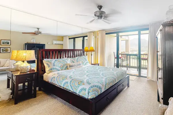 Rest comfortably in this welcoming bedroom with refreshing outdoor views