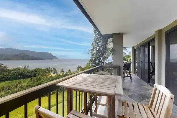 Enjoy outdoor dining while admiring sweeping mountain and tropical views