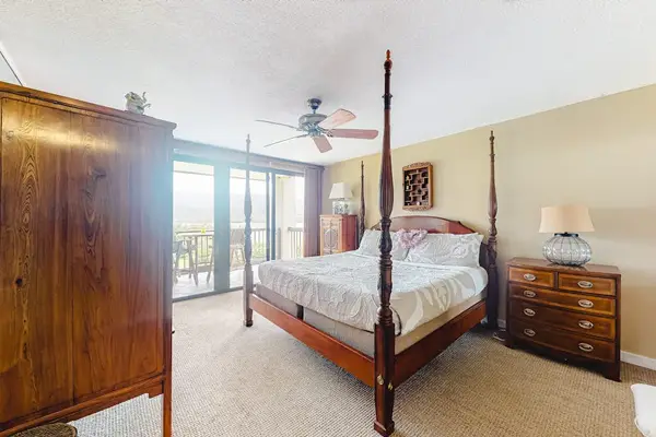 Recharge comfortably in this peaceful bedroom with relaxing outdoor views